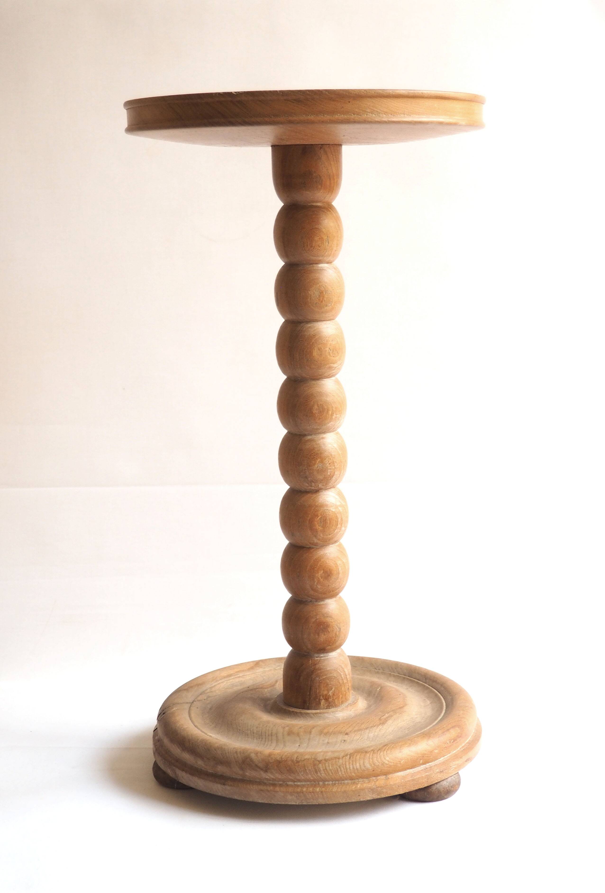 Beaded wood pedestal table