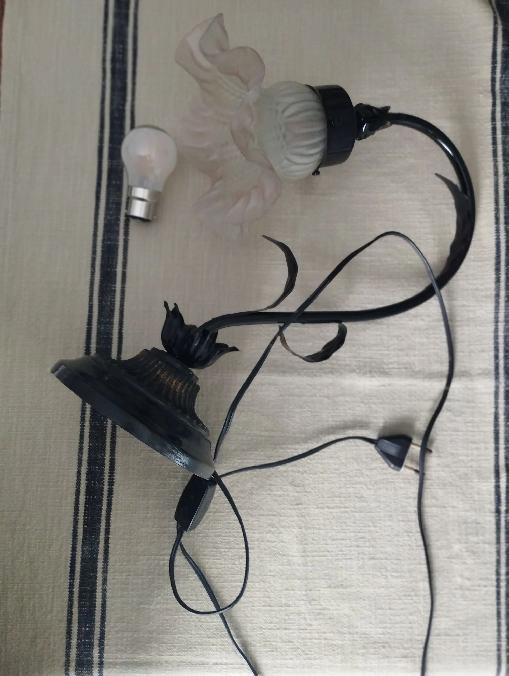Tulip lamp in patinated black metal with an opaque glass shade.