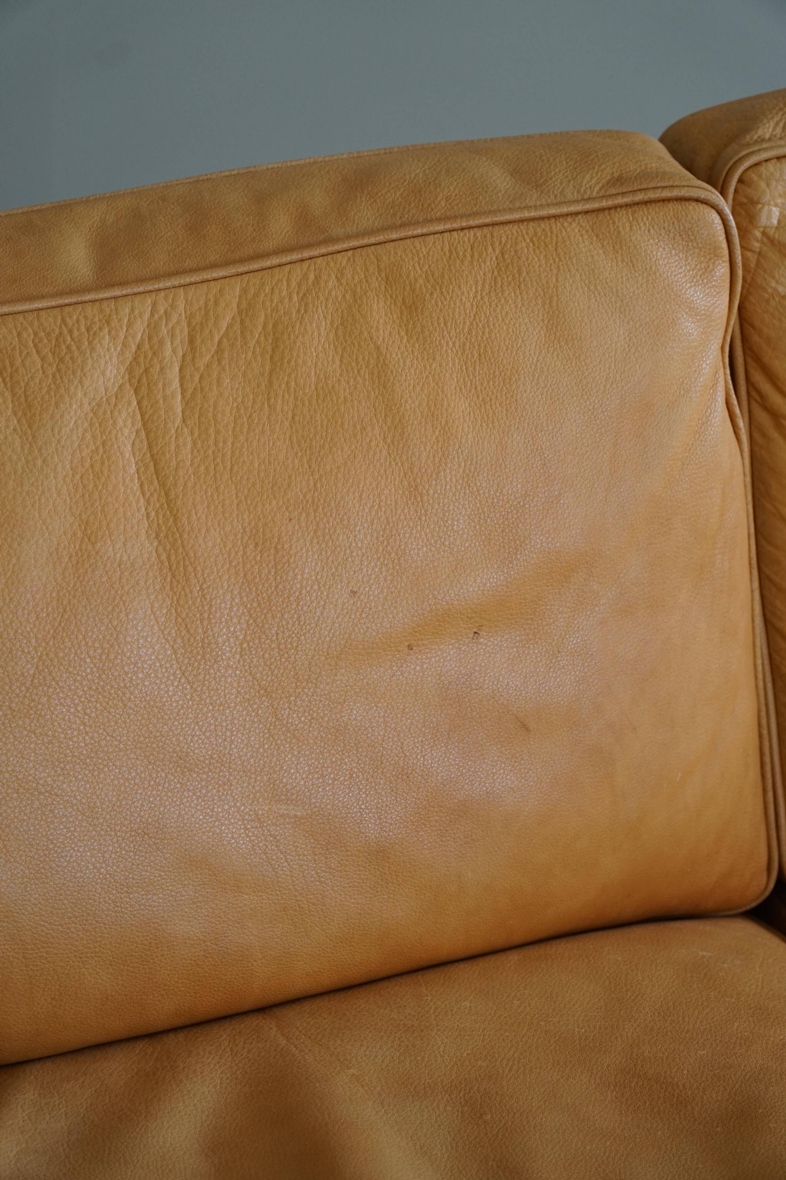 Danish Midcentury 3-seater canapé by Stouby in cognac brown leather, made in the 1970s.