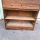 Vintage 1940s secretary desk with wooden curtains, storage, and shutters.