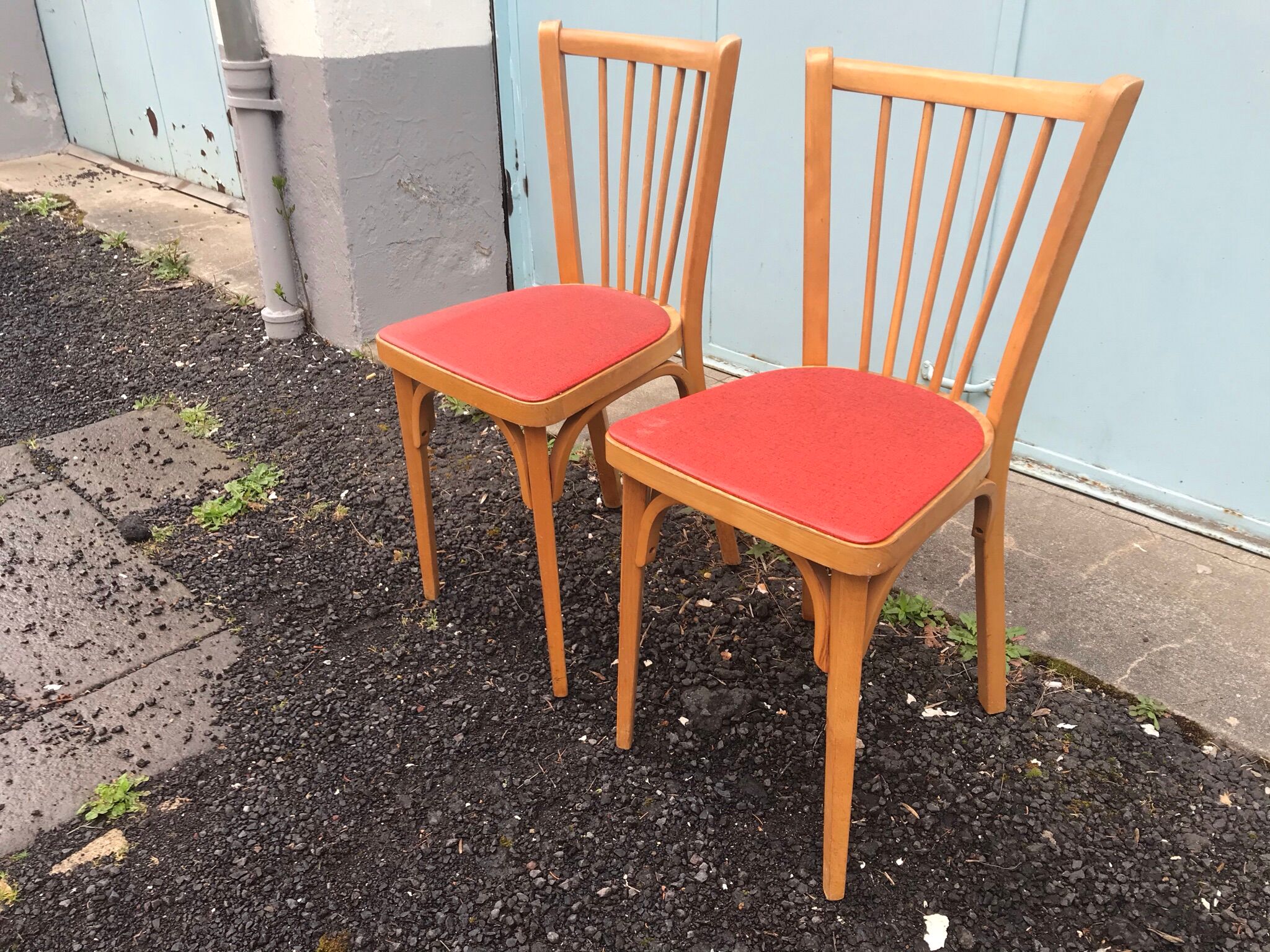 2 red Baumann bistro chairs