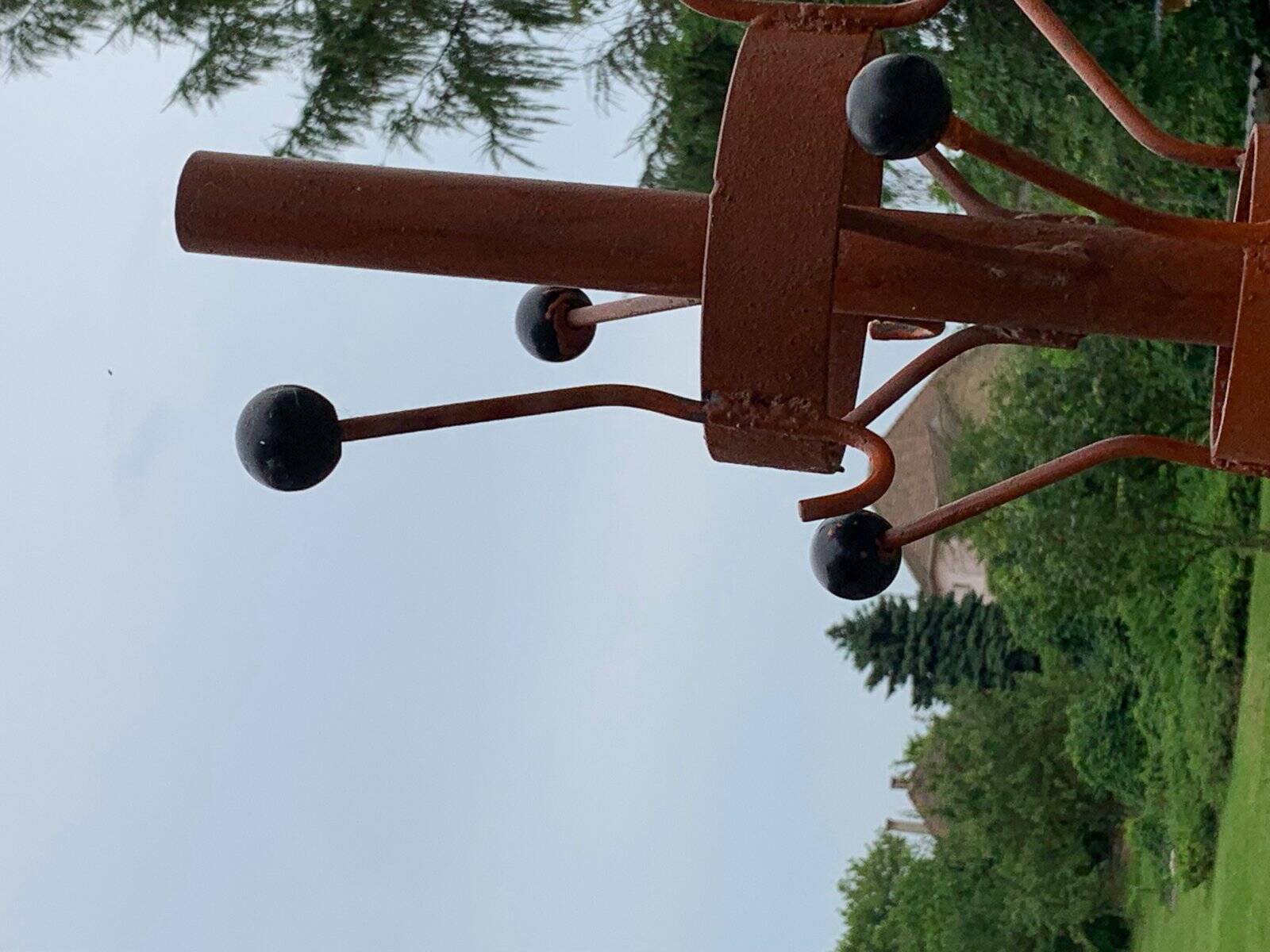 Vintage red industrial coat rack in cast iron, 1950s style, tripod base.