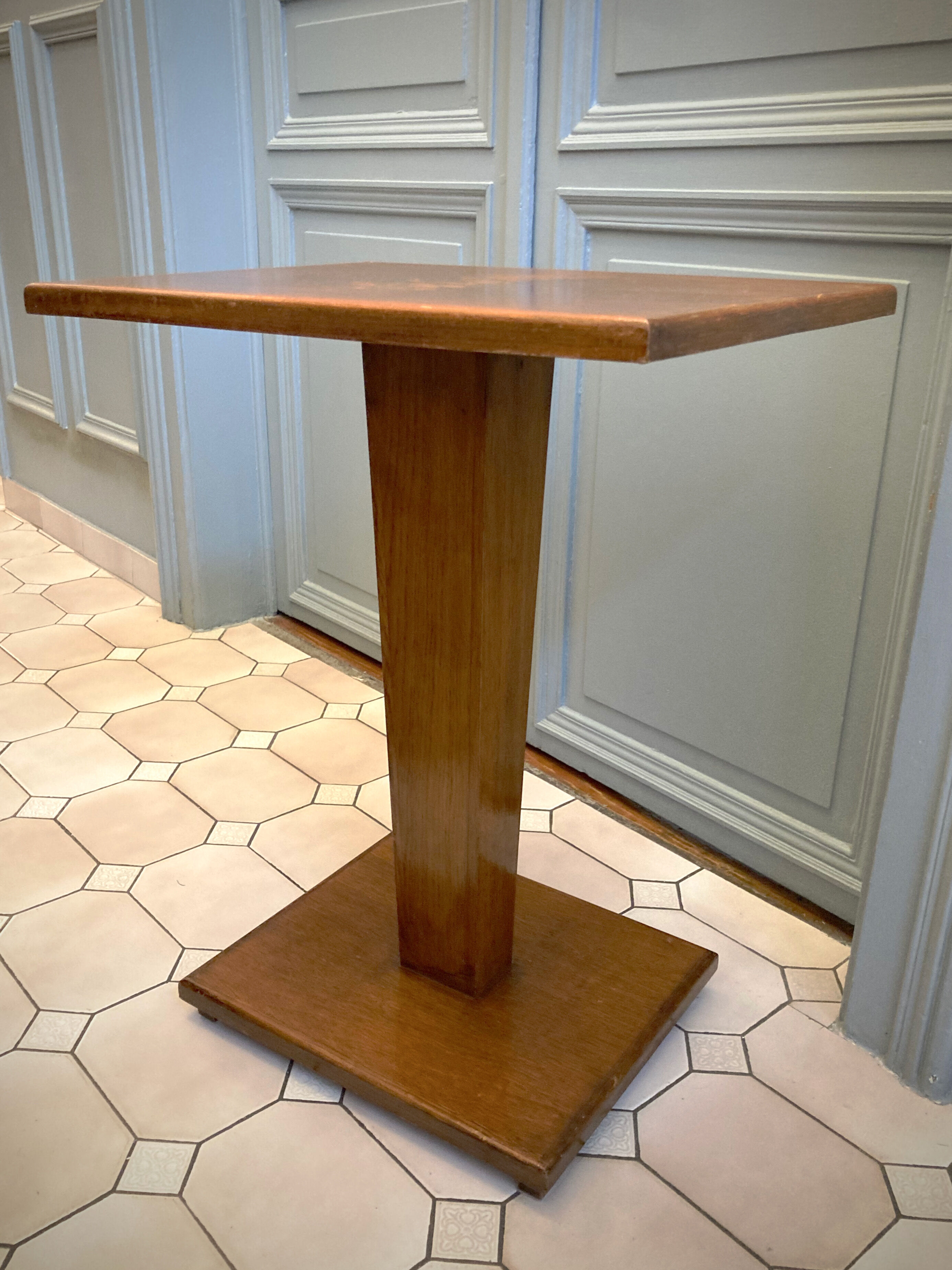 Square pedestal table with central foot 1930