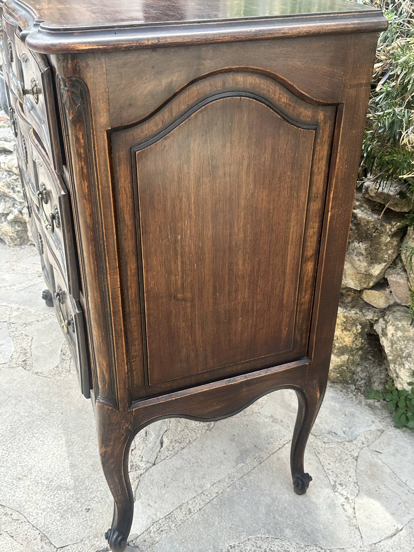 Carved and moulded solid wood commode in the Louis XV style.