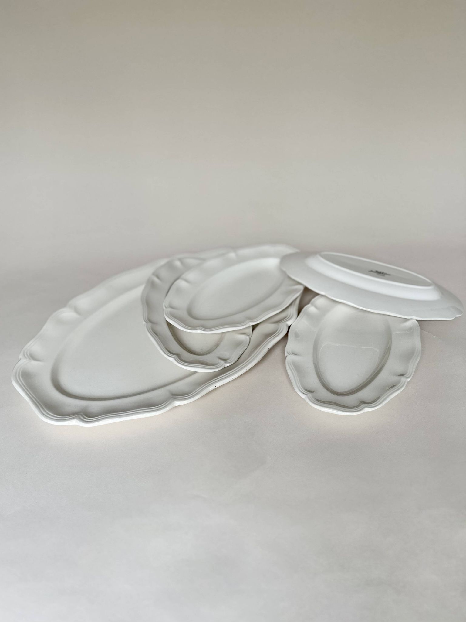 Shaped plates and dishes in Sarreguemines earthenware.