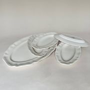 Shaped plates and dishes in Sarreguemines earthenware.