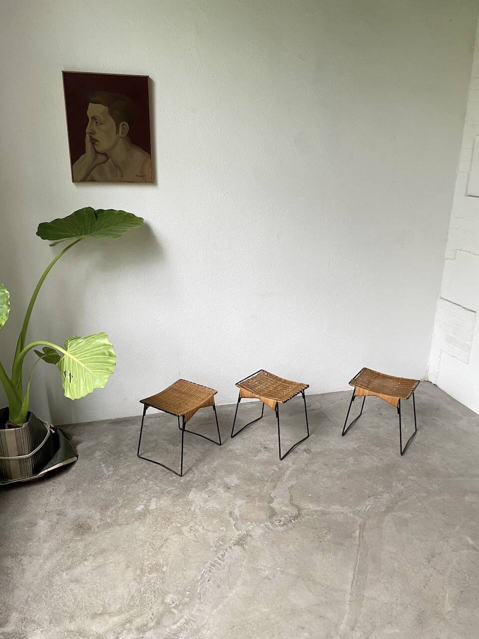 Set of three Raoul Guys wicker and metal stools