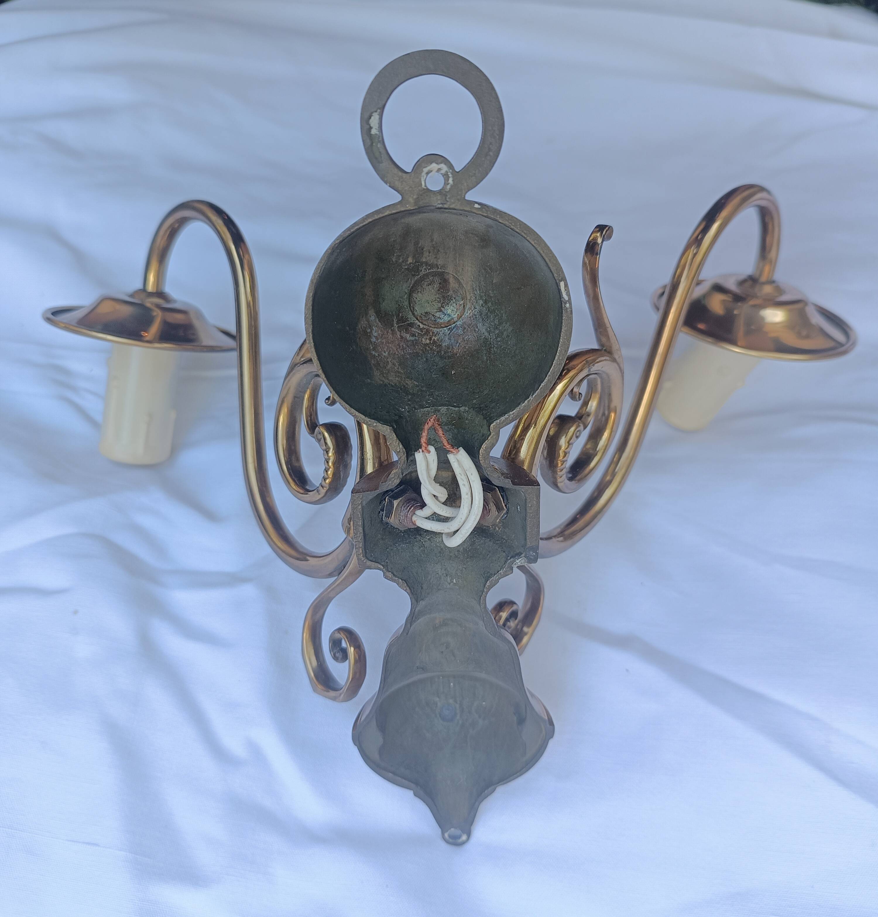Pair of wall sconces in gilded brass