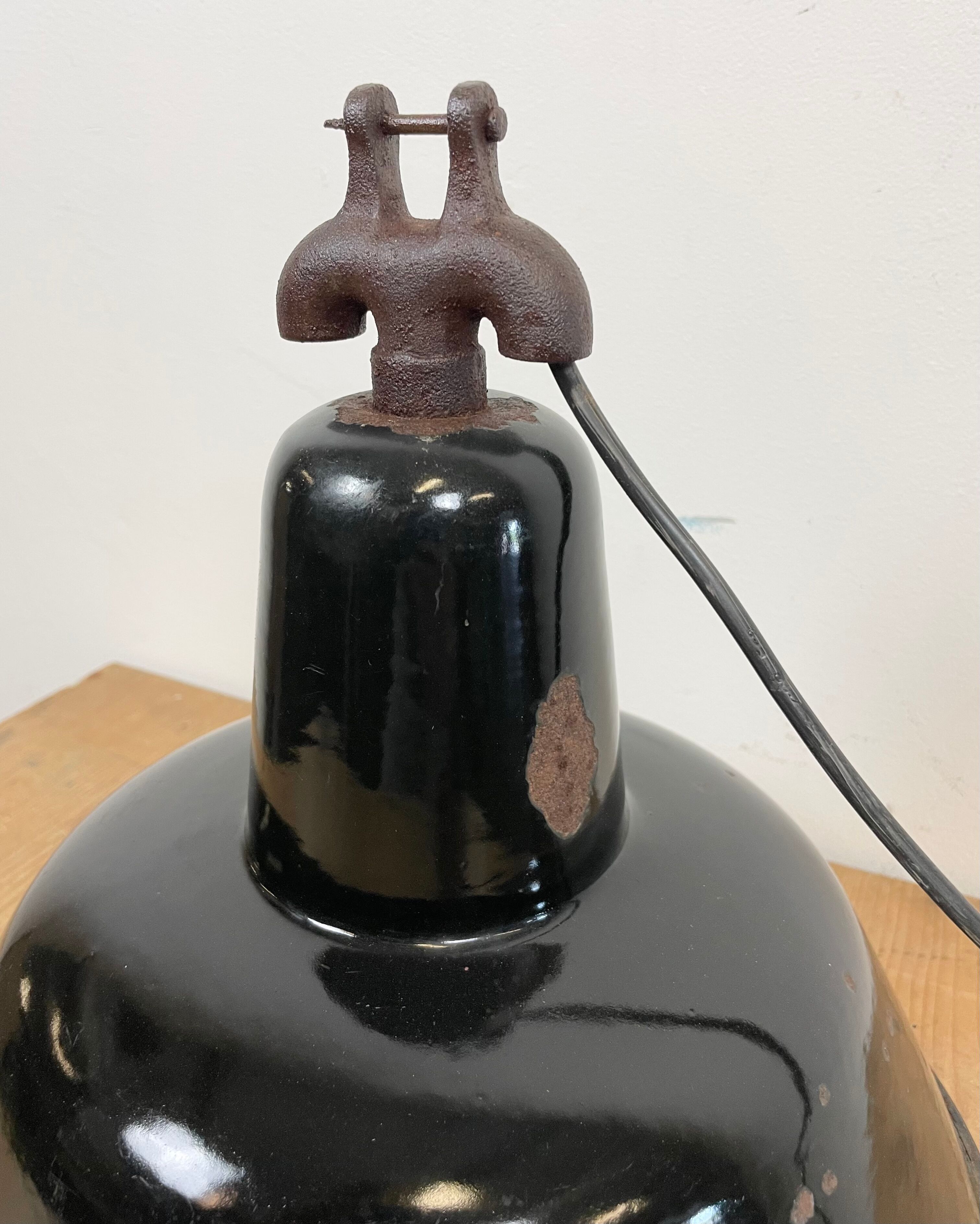 Industrial black enamel factory lamp with cast iron top, 1950s