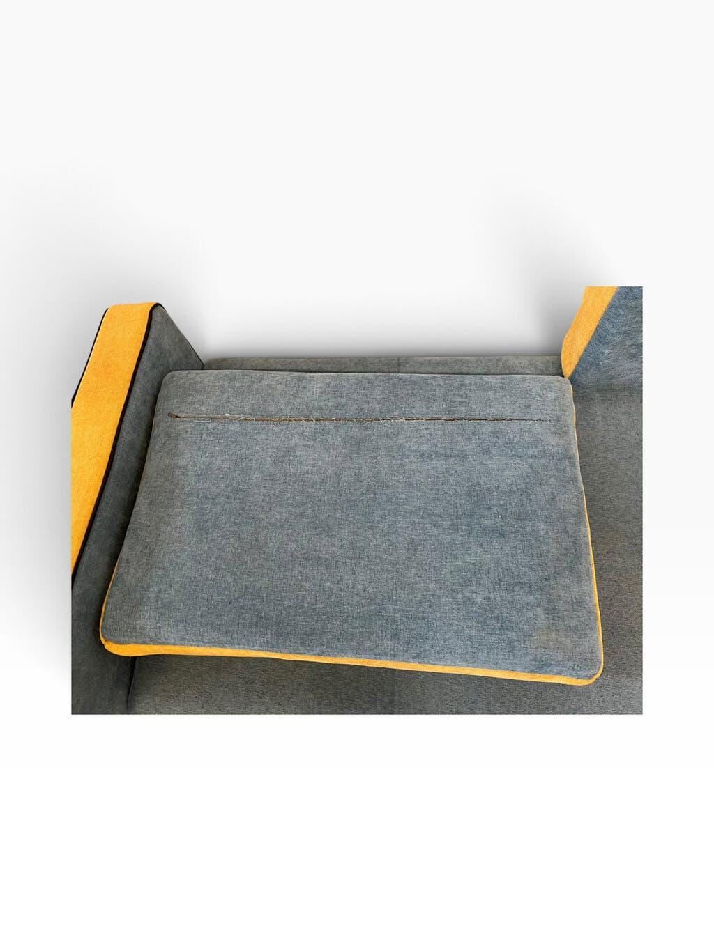 Vintage blue armchair/daybed/sofa bed with yellow accents.