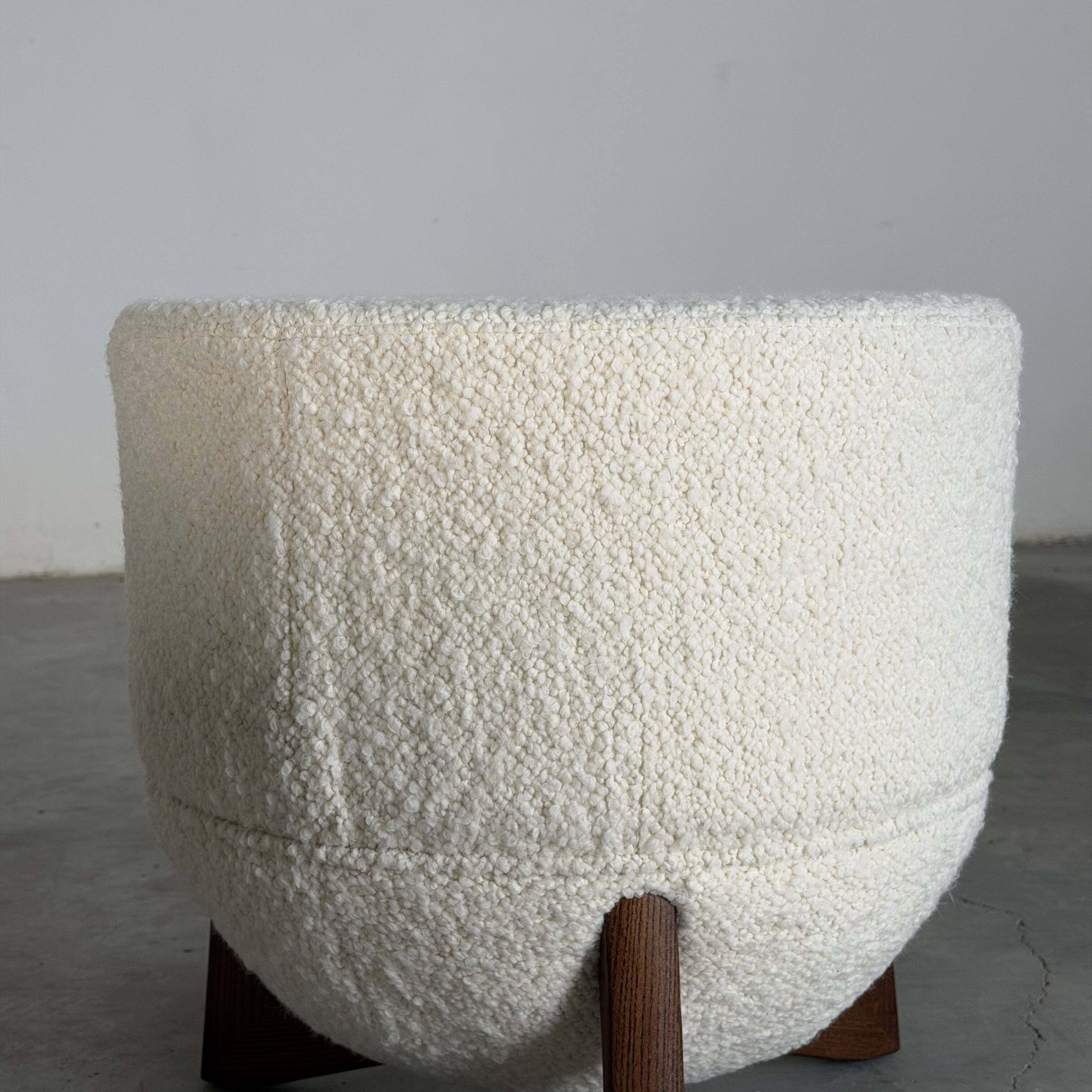 TOTEMO stools by FORME with ivory Dedar bouclé upholstery and walnut legs.