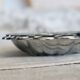Vintage shell pocket emptier in shiny silver metal