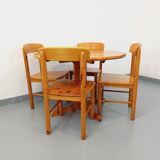 Suite of a round table with extension and 4 vintage pine chairs from the 60s and 70s