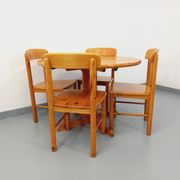 Suite of a round table with extension and 4 vintage pine chairs from the 60s and 70s