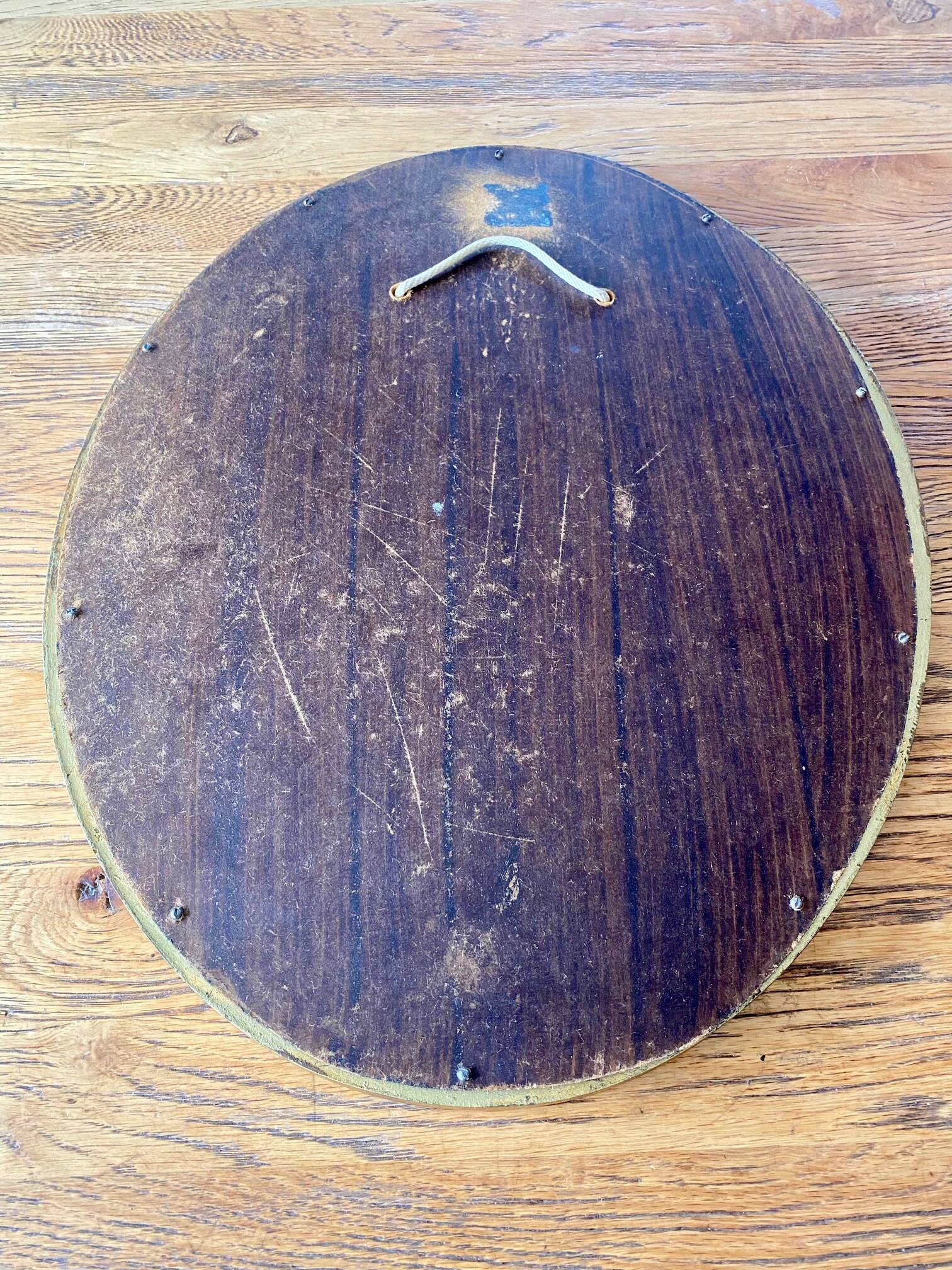 Antique gold oval mirror