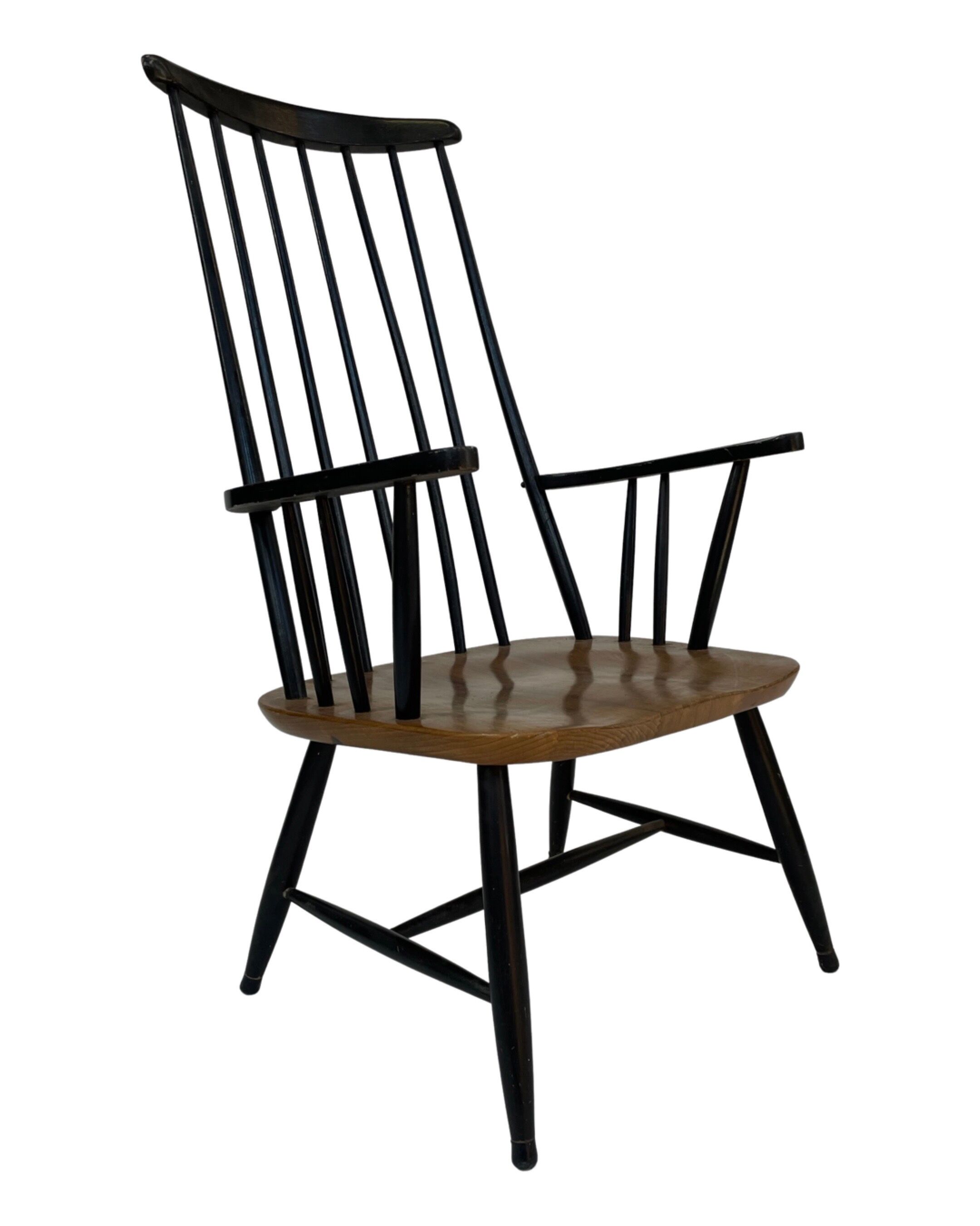 Vintage easy chair with high back and armrest from the 60s