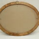 Large old oval gilded wooden frame and stucco decorations