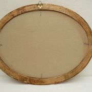 Large old oval gilded wooden frame and stucco decorations
