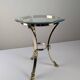 Neoclassical side table in brass and bevelled glass with ram's heads, 1970s.