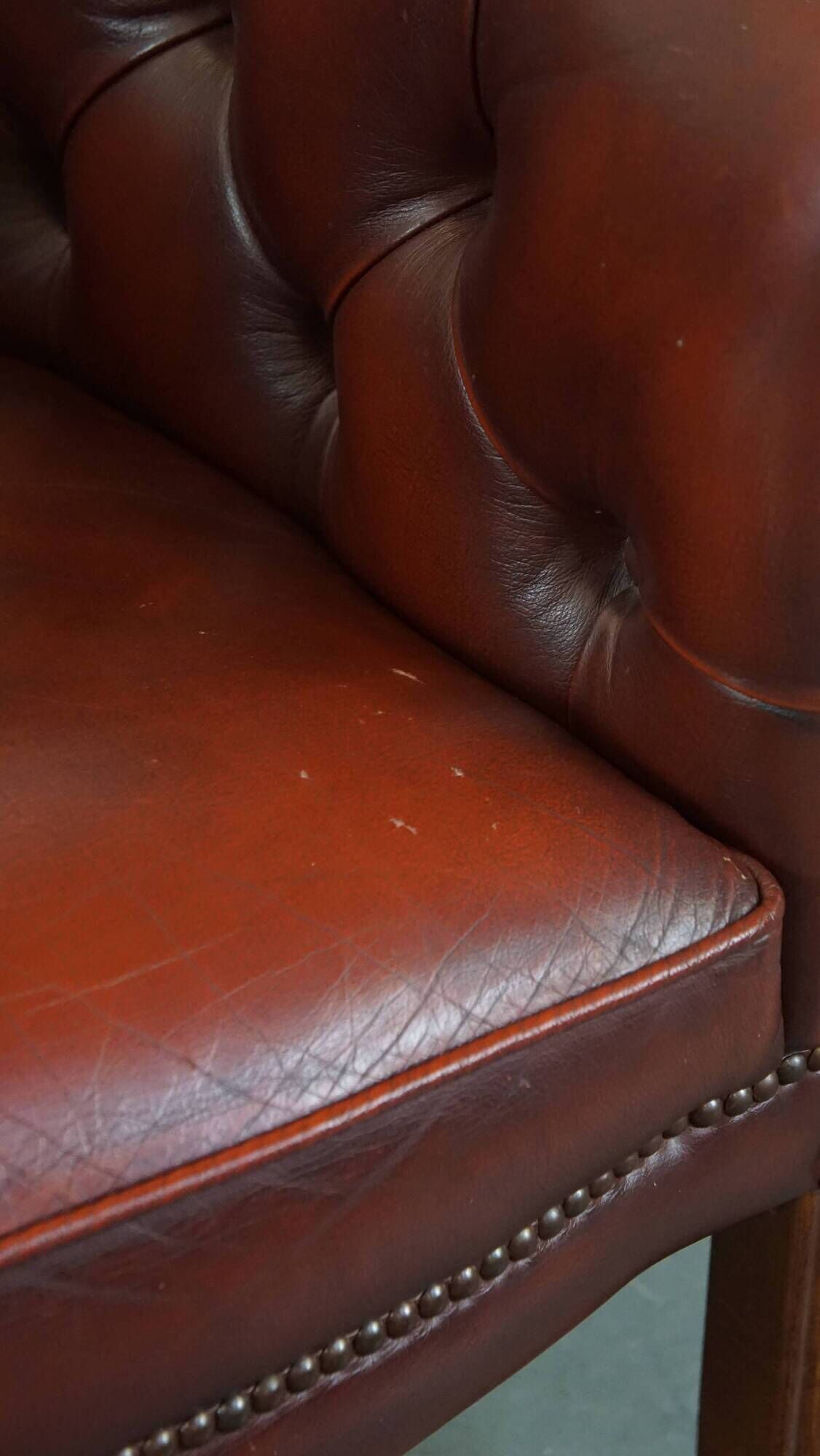 Red cow leather English chesterfield club chair