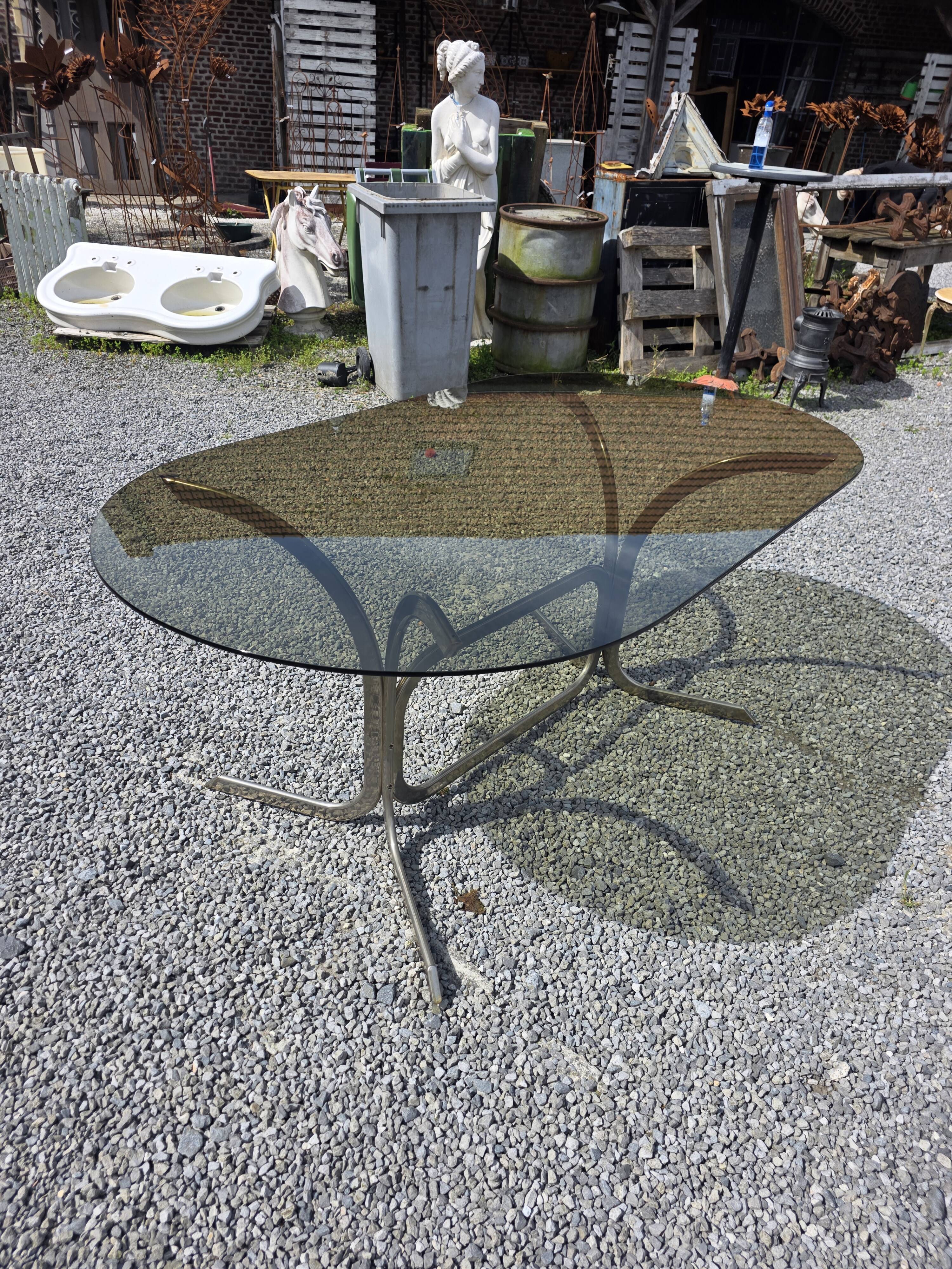 Silver metal table with smoked glass top from the 1970s.