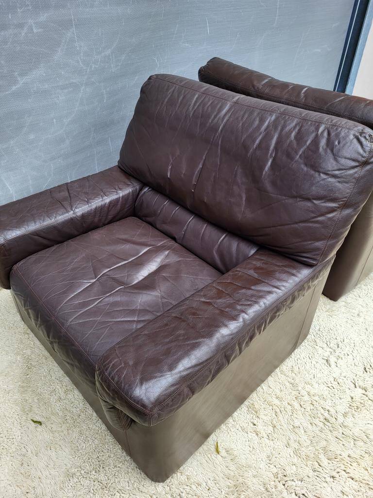 Pair of chocolate leather lounge chairs