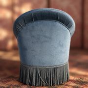 Vintage blue velvet frog chair, a timeless comfortable piece.