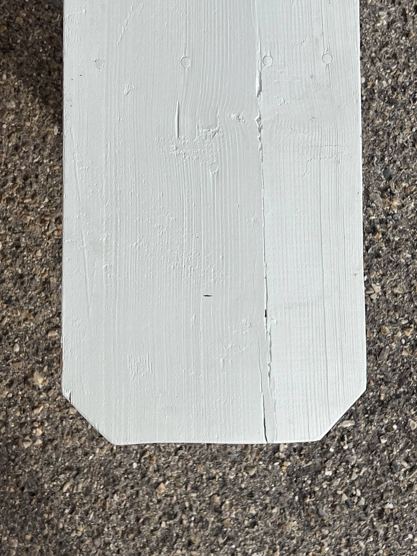 Pair of wooden benches painted white, French artisanal work.