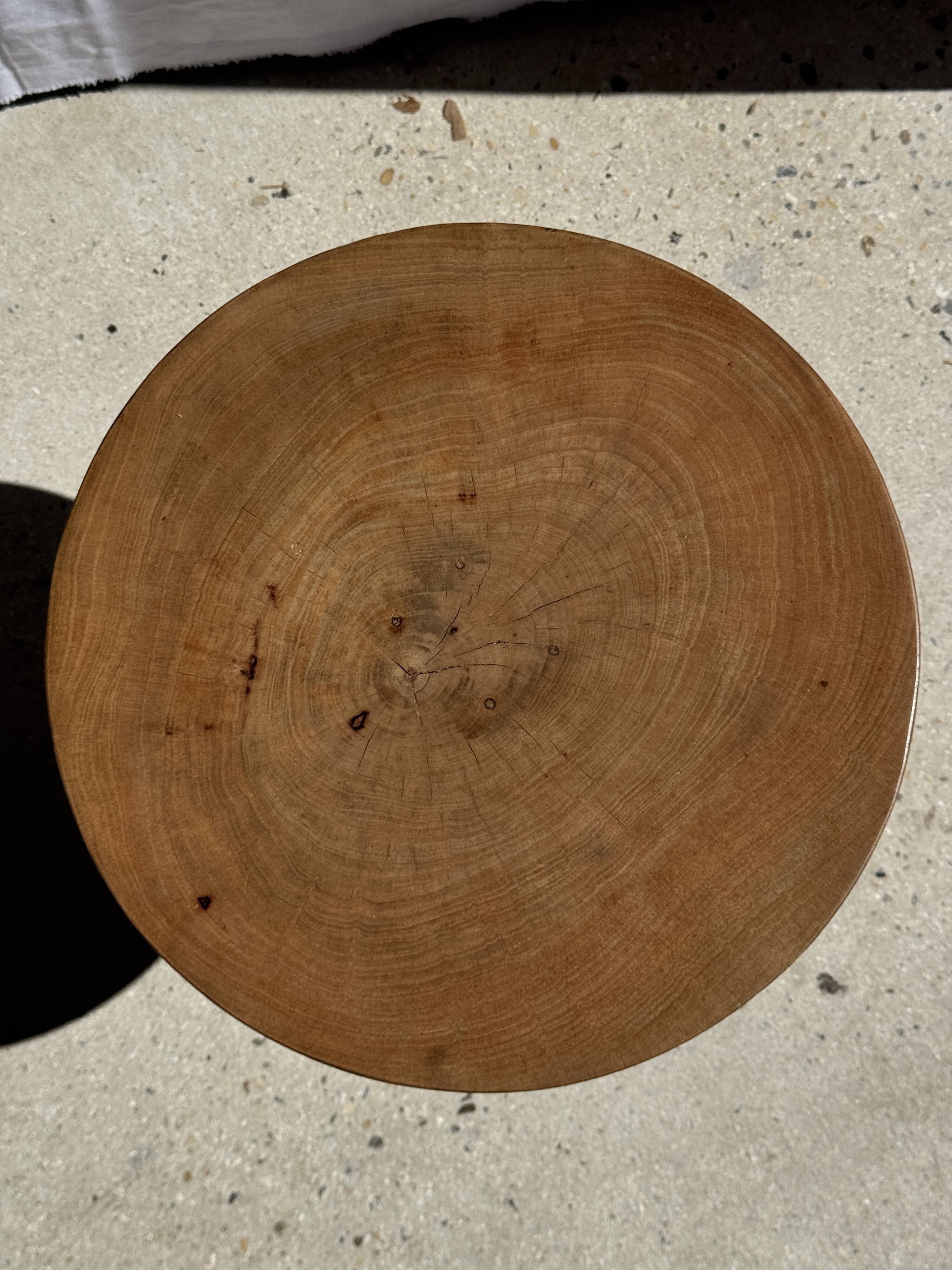 Natural solid mango side table (monoxyle) with conical legs.