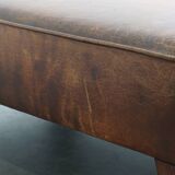 Hocker/coffee table made of sheepskin