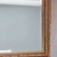Miroir en bois stuc doré et verre biseauté