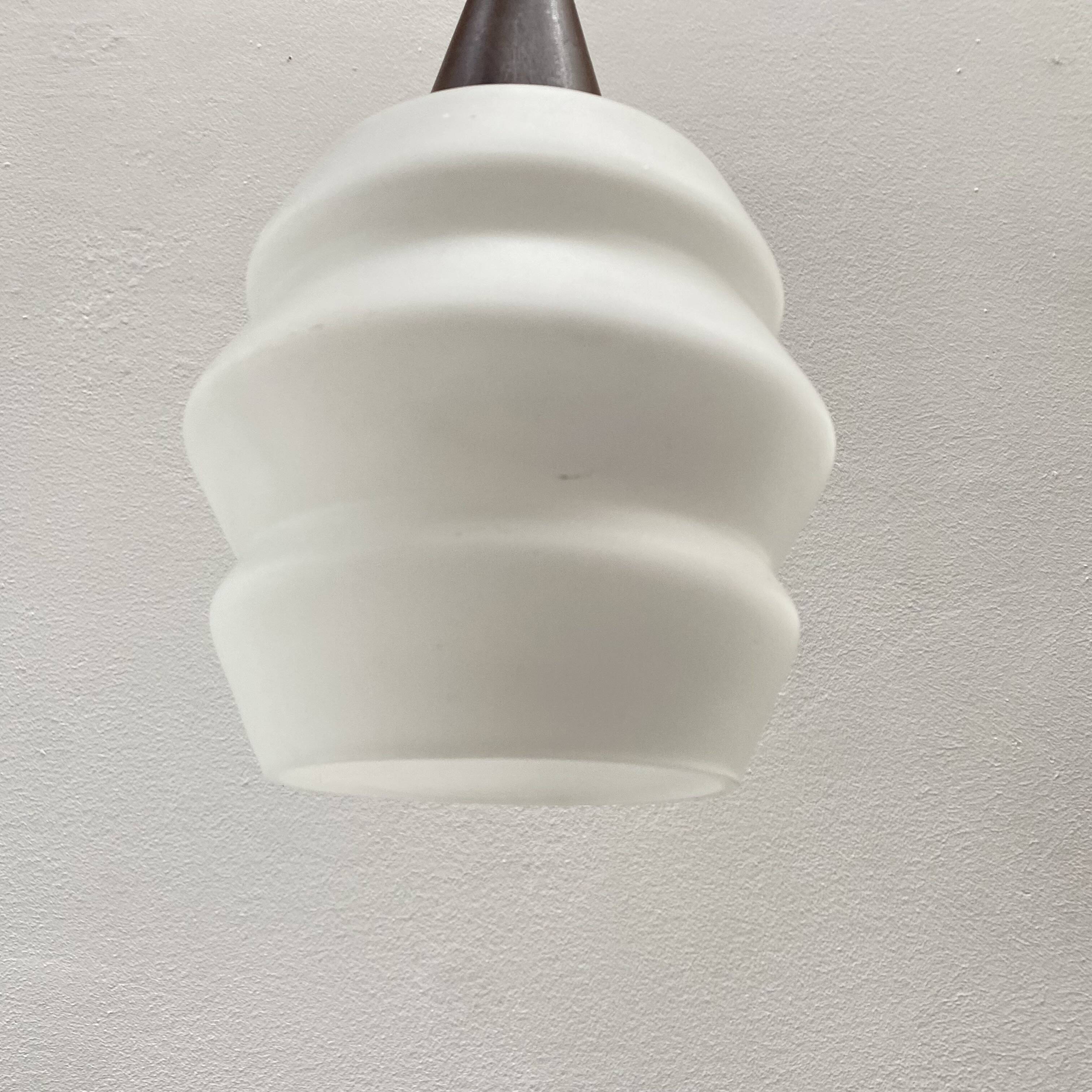 Teak and opaline pendant light from the 60s by Louis Kalff for Philips