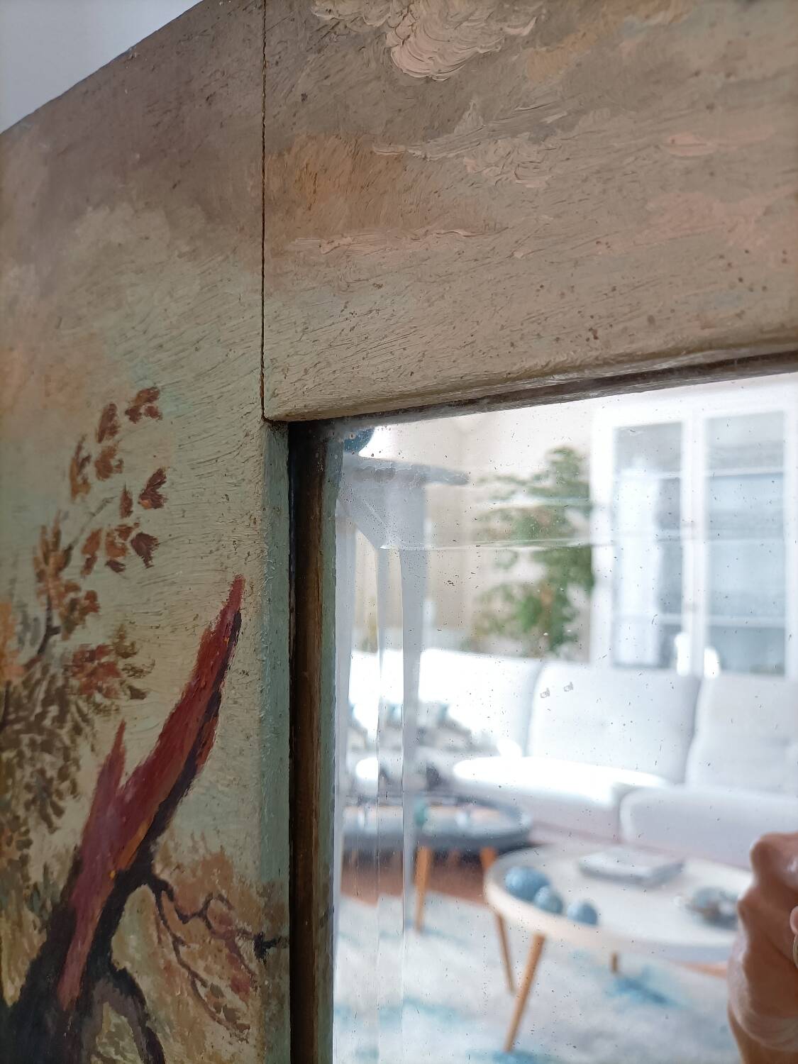 Very large mirror painted in Victorian style.