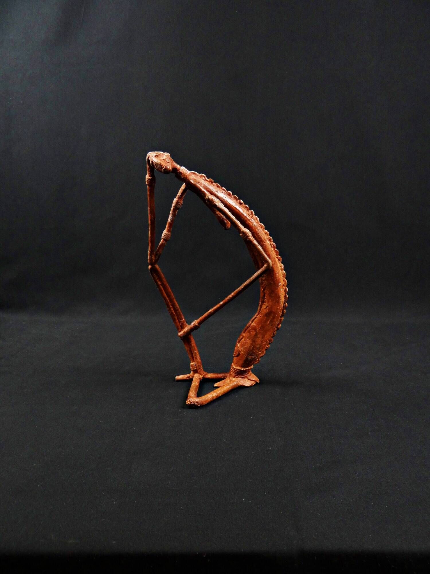 Dogon Nommo bronze statue with brown patina and red highlights, mid-20th century