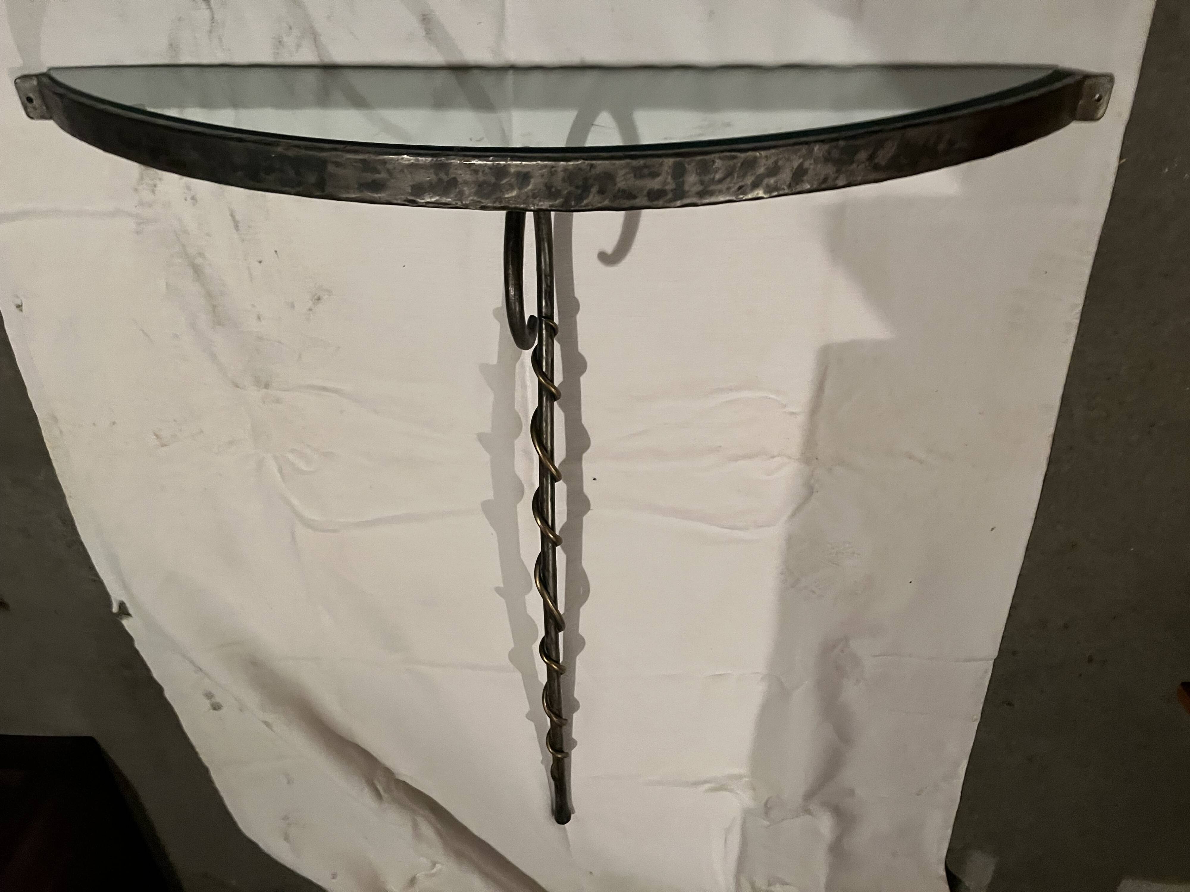 Console design in brushed steel and glass