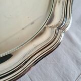 Round silver-plated serving dish with a glass base.