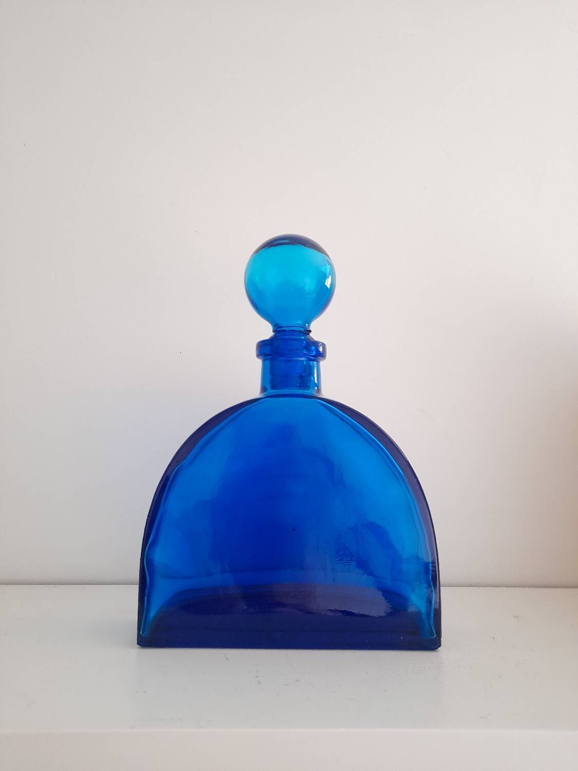 Blue pressed glass half circle carafe