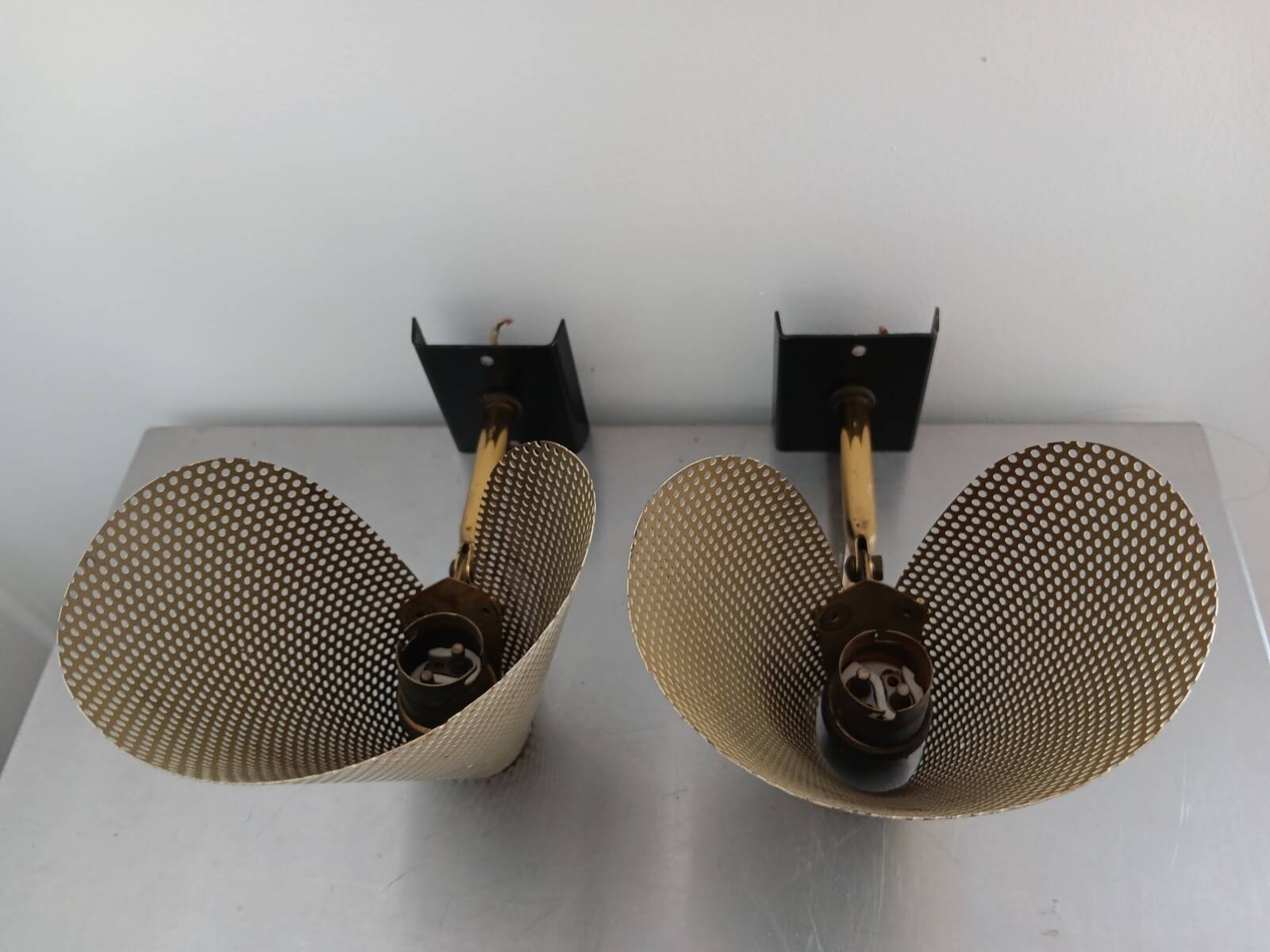 Pair of perforated metal horn wall lights