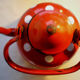 Vintage kettle in red enamelled sheet with white polka dots