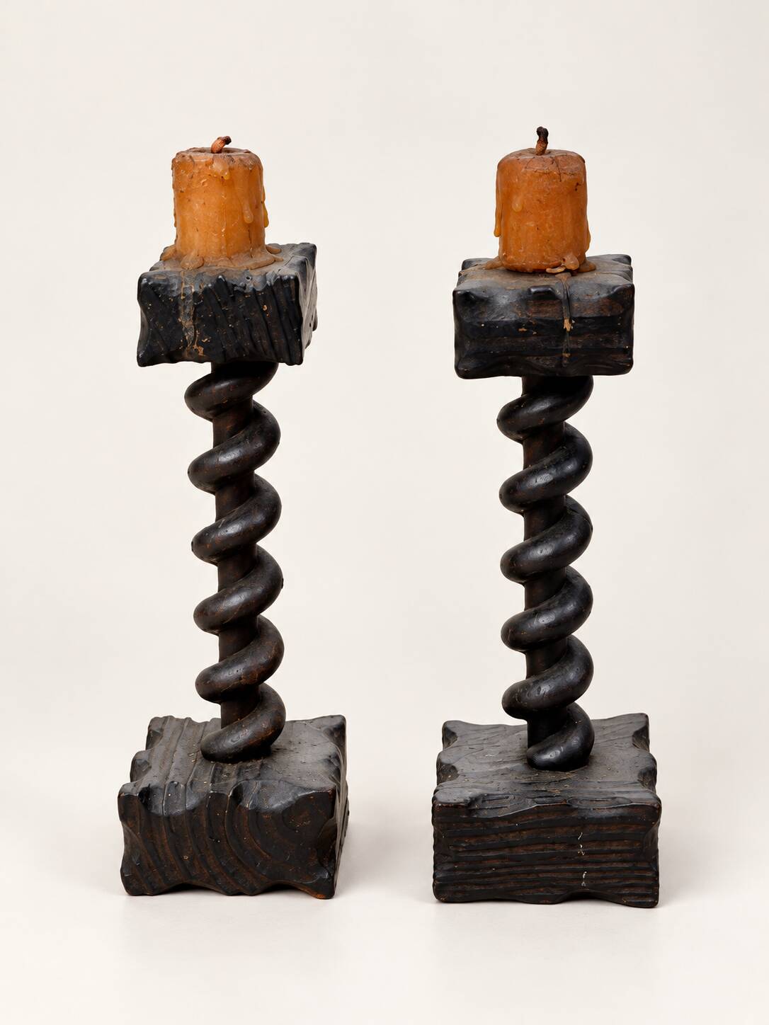 Charming pair of antique turned wooden candlesticks, featuring a beautiful p