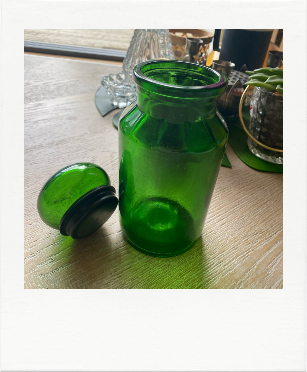 Emerald green glass bottle