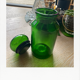 Emerald green glass bottle