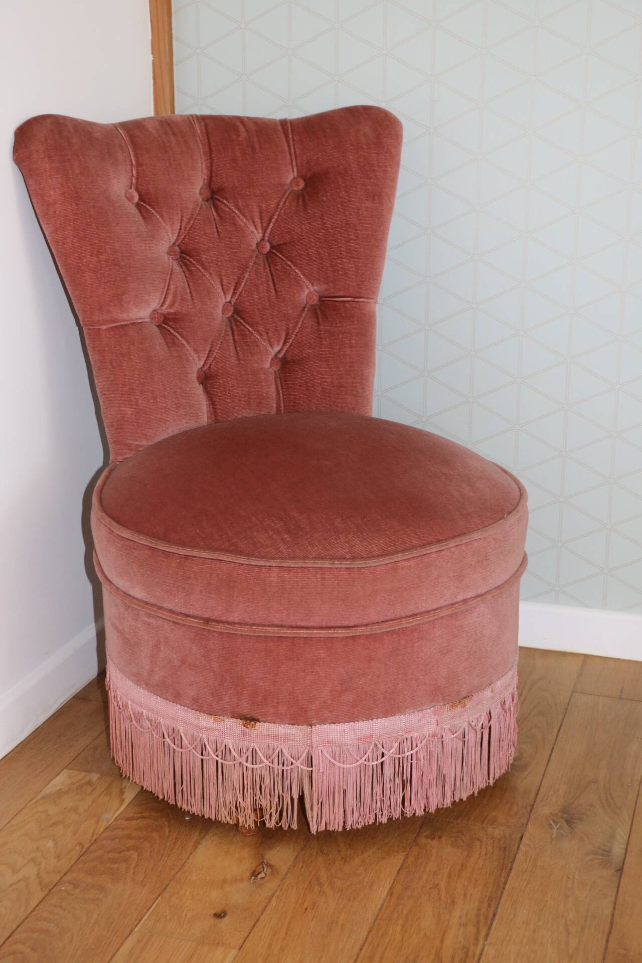 Powder pink fireside chair with fringes