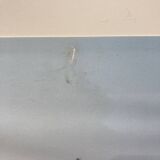 Laminated photograph.