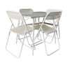 Ensemble table pliante et ses 4 chaises pliantes métal perforées couleur crème - années 70