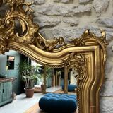 Antique mirror 169/105cm with pediments and pearl detailing in gold leaf.