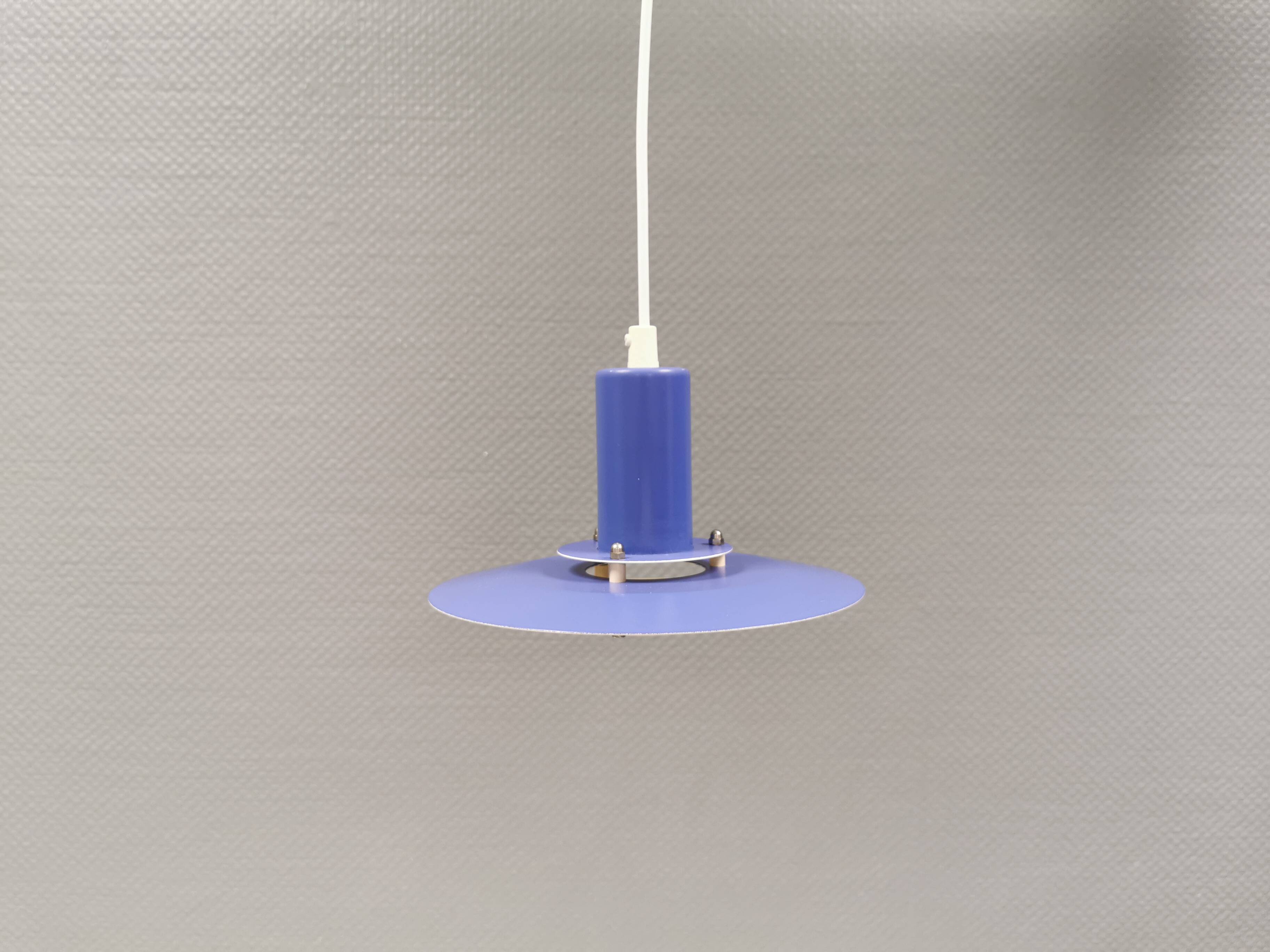 A blue minimalist hanging lamp from Lyfa Denmark 1980s.