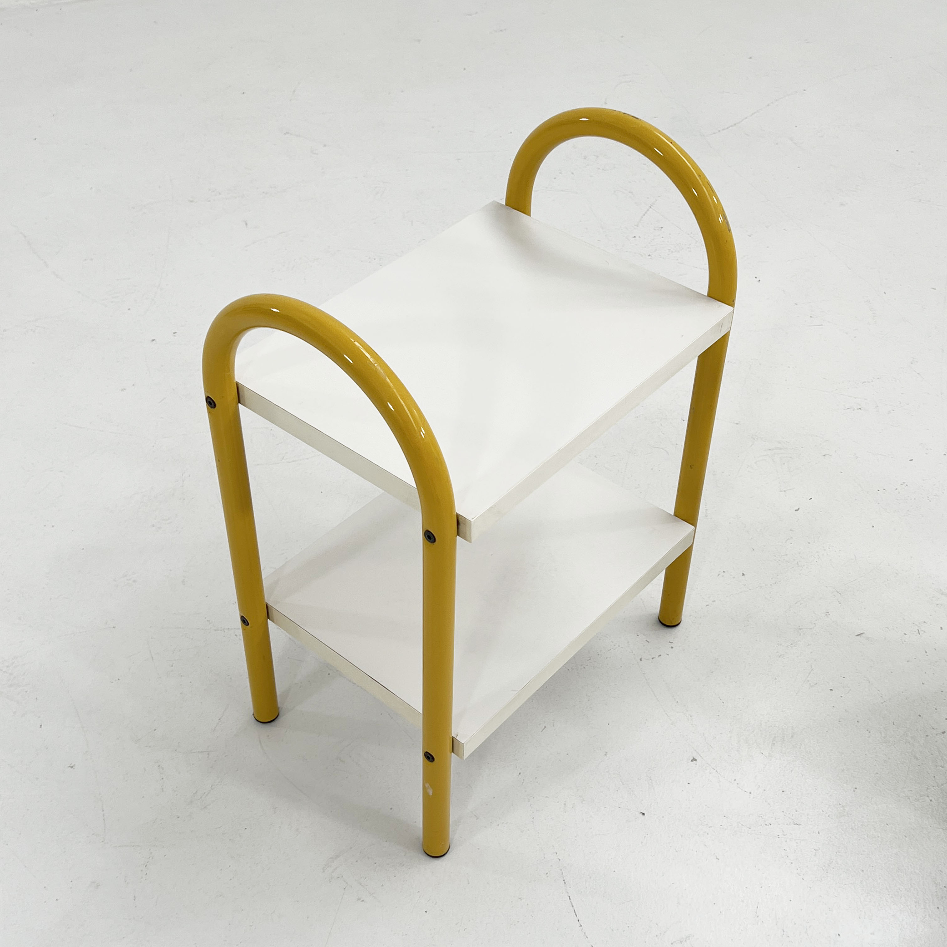 Pair of yellow tubular bedside tables, 1980