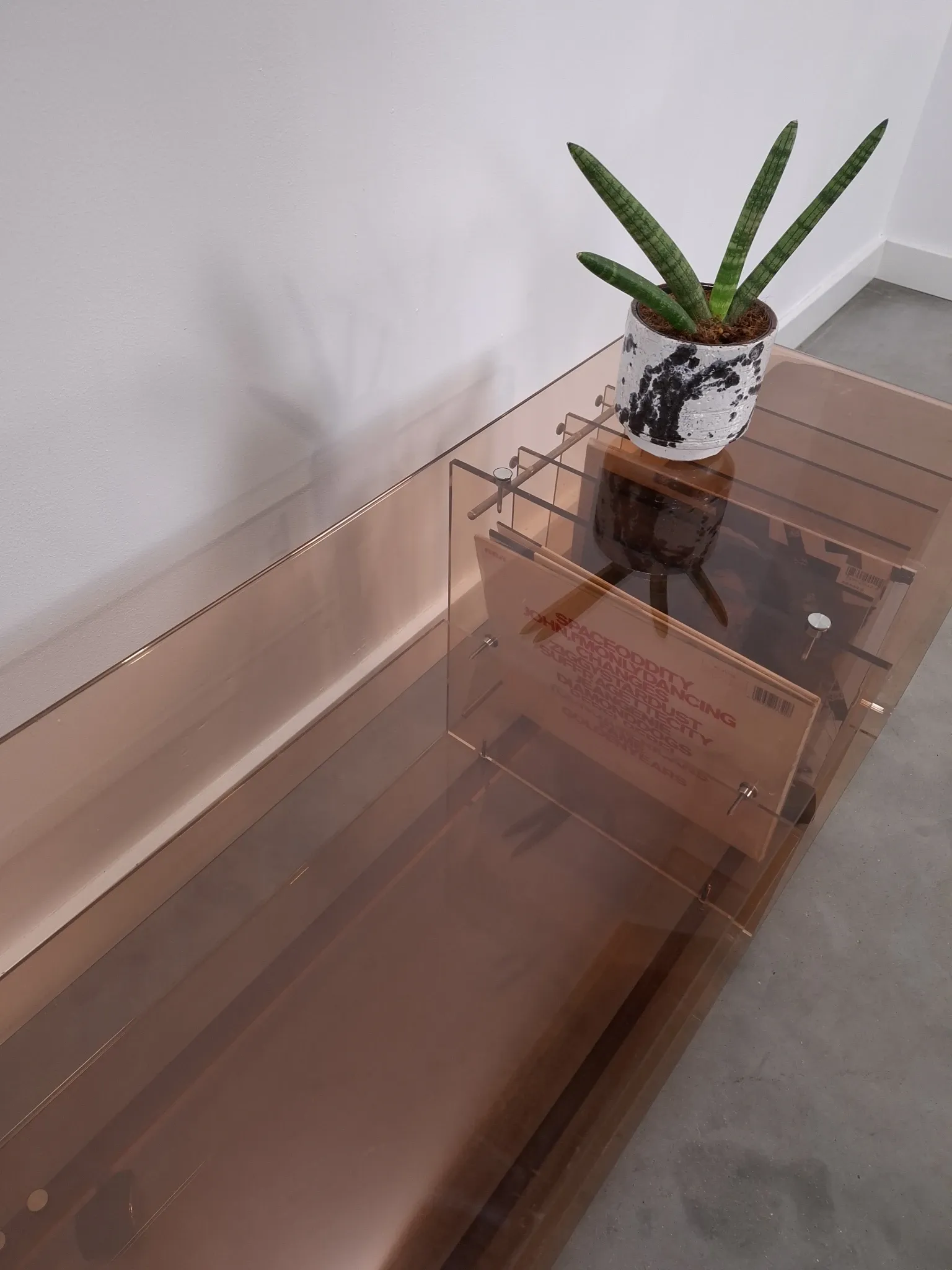 Vintage hifi, LP cabinet, TV unit made of tinted plexiglass on wheels, records.