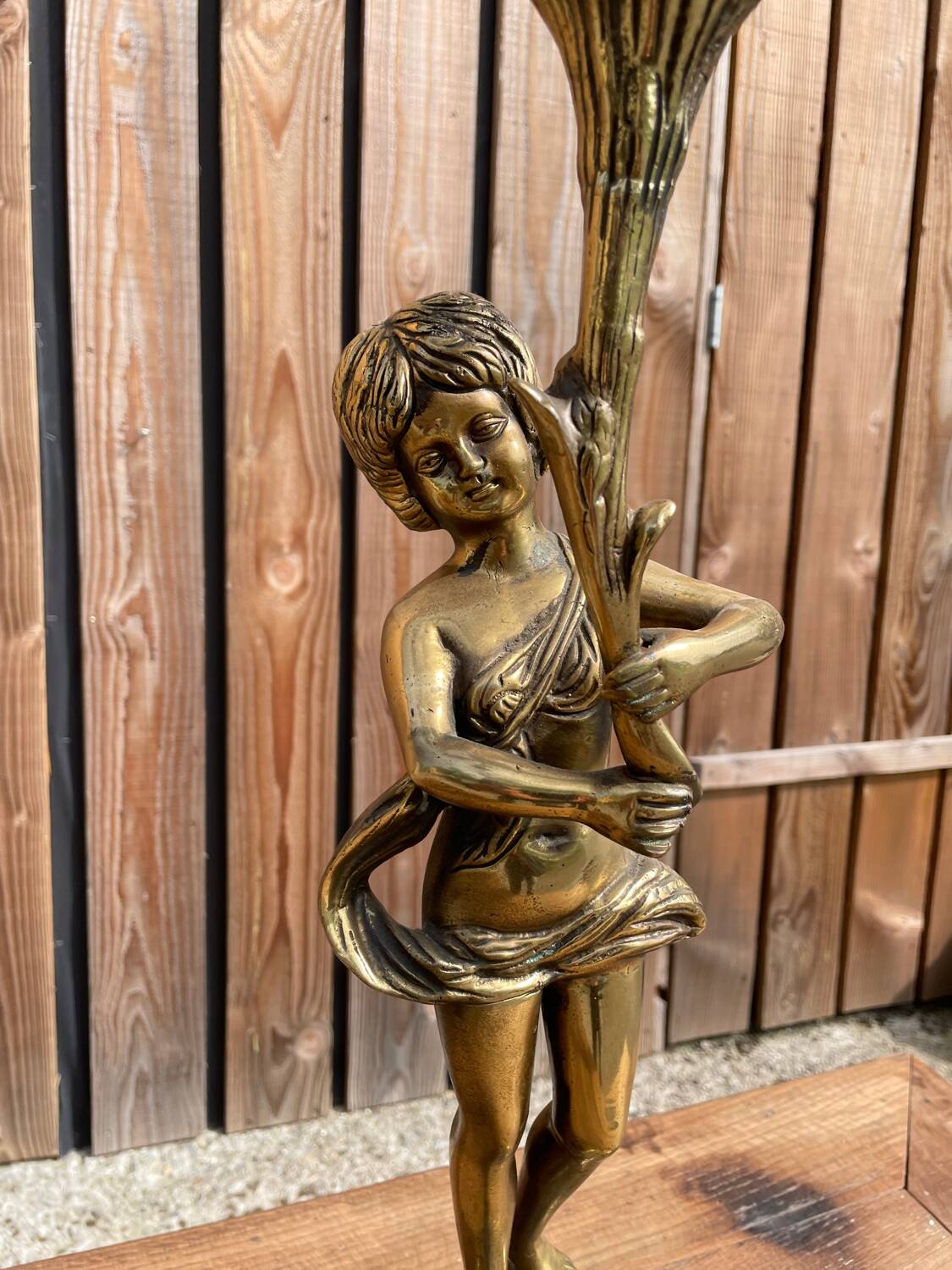 Large bronze candle holder with putti angel
